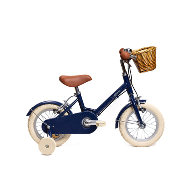 Vélo enfant Bebikeen 12 pouces bleu marine, 2 à 4 ans, profil droit avec roues stabilisatrices.