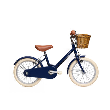 Vélo enfant BeBikeen 16 pouces bleu marine pour enfants de 4 à 6 ans, léger, élégant et sûr avec panier en osier naturel, vue de profil droit.