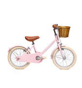 Vélo enfant BeBikeen 16 pouces rose pour enfants de 4 à 6 ans, léger, élégant et sûr avec panier en osier naturel, vue de profil droit.