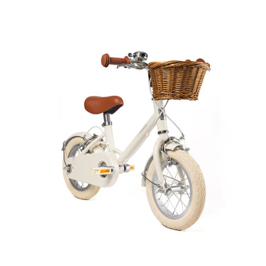 Vélo enfant Bebikeen 12 pouces crème léger, 2 à 4 ans, vue 3/4 avant avec panier en osier naturel.