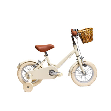 Vélo enfant Bebikeen 12 pouces crème léger, 2 à 4 ans, profil droit avec roues stabilisatrices et panier en osier.