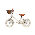 Vélo enfant Bebikeen 12 pouces crème léger, 2 à 4 ans, profil gauche avec stabilisateurs et panier en osier.