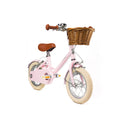Vélo enfant Bebikeen 12 pouces rose léger, 2 à 4 ans, vue 3/4 avant avec panier en osier élégant.