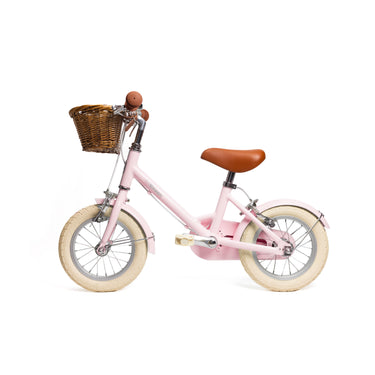Vélo enfant Bebikeen 12 pouces rose léger, 2 à 4 ans, profil gauche avec 
panier en osier.