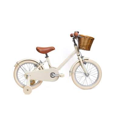 Vélo enfant Bebikeen 16 pouces crème léger, 4 à 6 ans, profil droit avec stabilisateurs et panier en osier naturel.